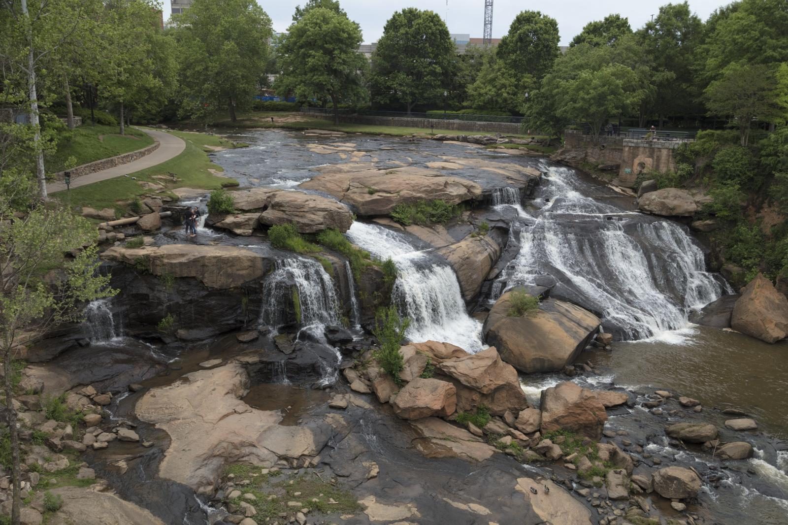 Waterfalls and a riverside path in Innovation Falls Park in downtown Brightwater